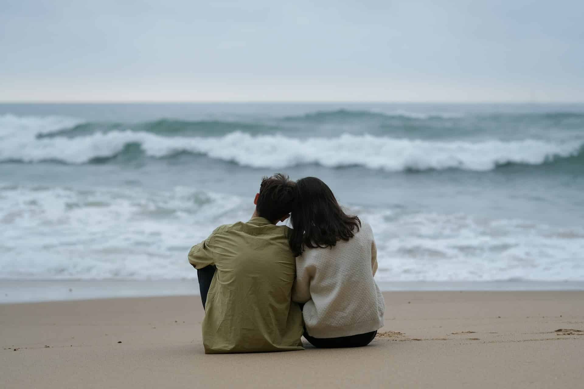couple sitting on the beach